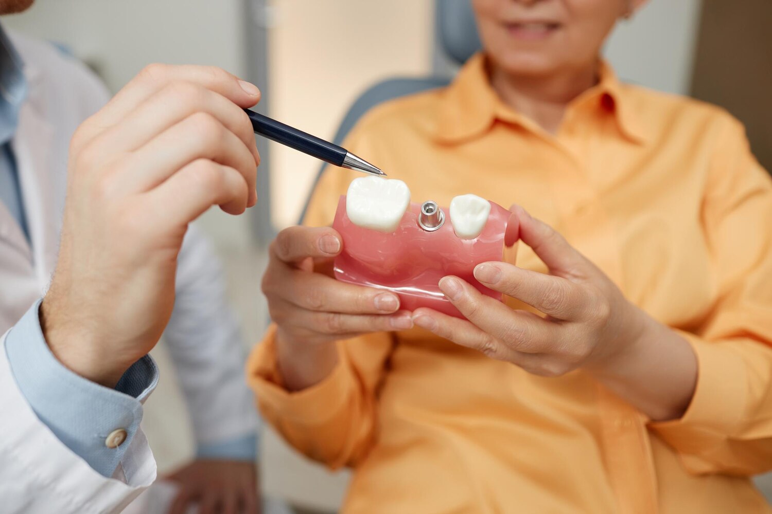 closeup unrecognizable dentist pointing tooth model 236854 50084 closeup unrecognizable dentist pointing tooth model 236854 50084