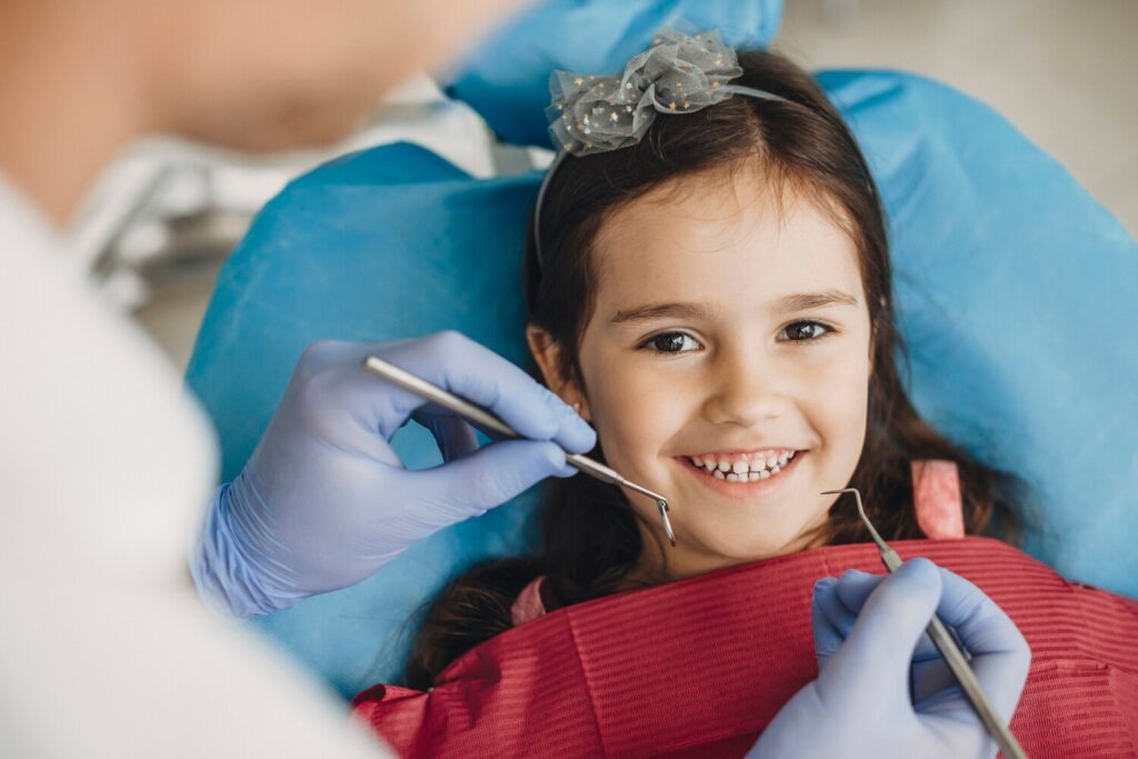 close up happy little girl looking camera before teeth examination pediatric stomatology 129180 2998 close up happy little girl looking camera before teeth examination pediatric stomatology 129180 2998